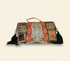 Model carrying Shell Tassel Ratrani crossbody bag — boho style