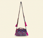 Model carrying Shell Tassel Kajariya crossbody bag — boho style