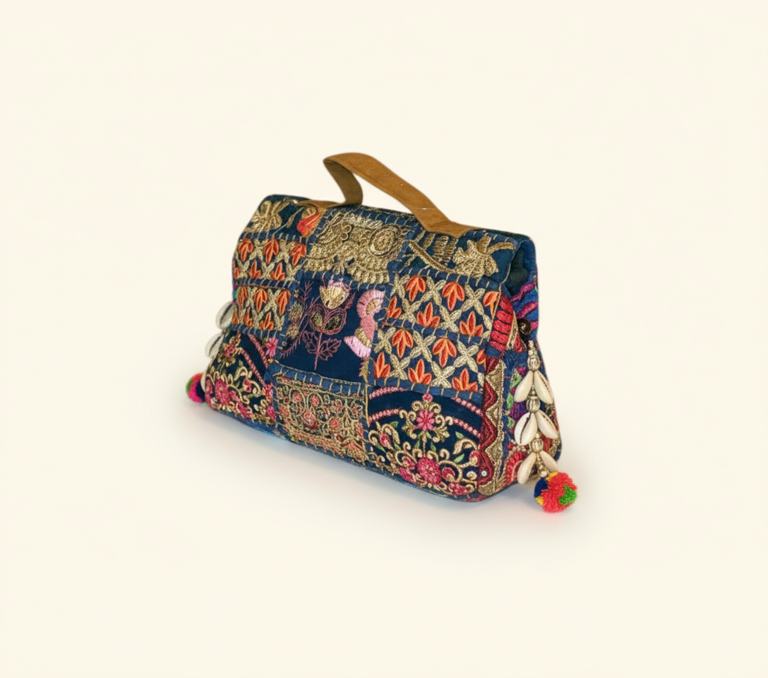 Close-up of Kali Rangoli cowrie shell & tassel detail