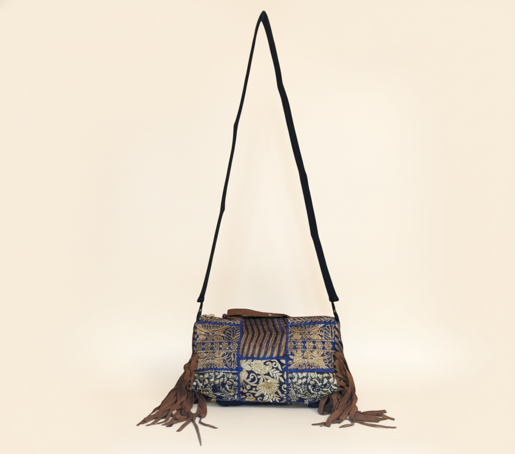Close-up of Samudra cowrie shell & tassel detail