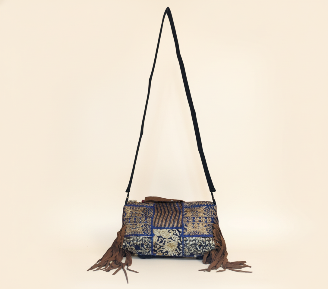 Close-up of Samudra cowrie shell & tassel detail