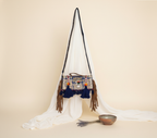 Model carrying Shell Tassel Samudra crossbody bag — boho style