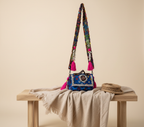 Close-up of Neel Mani cowrie shell & tassel detail