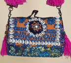 Shell Tassel Aparajita crossbody bag side view showing depth