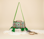 Model carrying Shell Tassel Tulsi crossbody bag — boho style