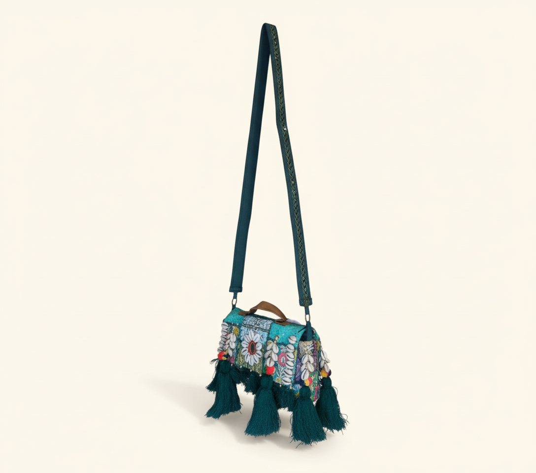 Model carrying Shell Tassel Panna crossbody bag — boho style