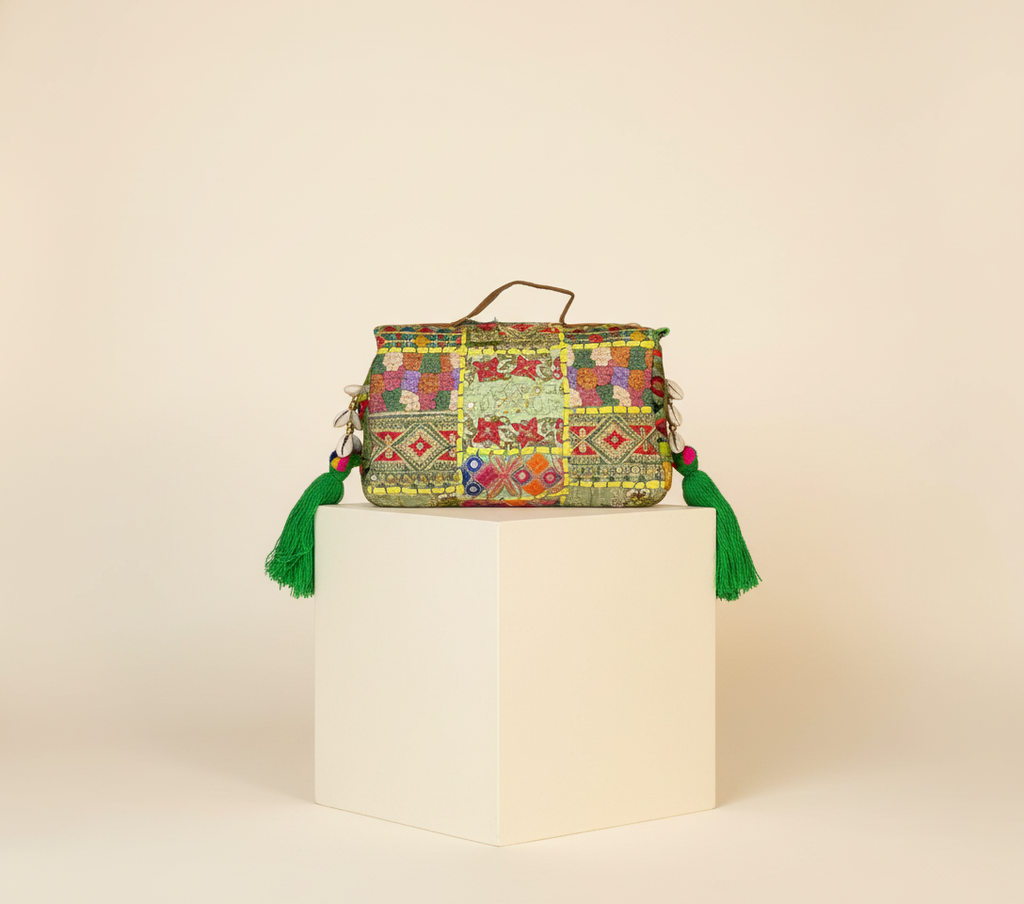 Model walking with Shell Tassel Haritima crossbody bag — lifestyle shot