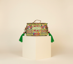 Model walking with Shell Tassel Haritima crossbody bag — lifestyle shot