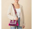 Model carrying Shell Tassel Gulabi Aag crossbody bag — boho style