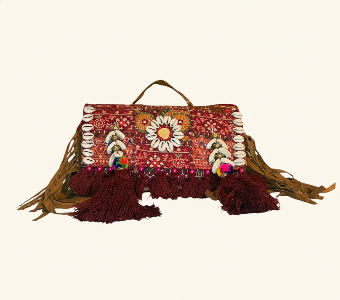 Shell Tassel Katan crossbody bag side view showing depth