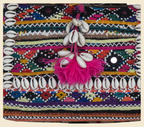 Close-up of Chitra cowrie shell & tassel detail