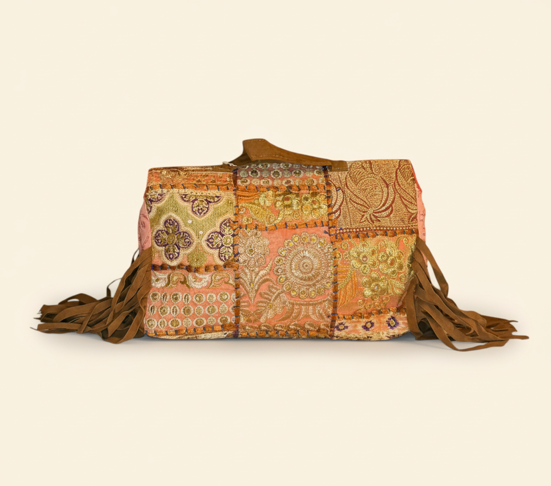 Model carrying Shell Tassel Narangi crossbody bag — boho style
