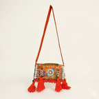 Model walking with Shell Tassel Sandhya crossbody bag — lifestyle shot