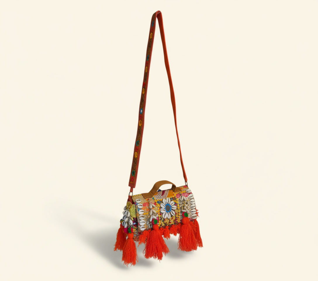 Close-up of Moonga cowrie shell & tassel detail