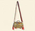 Model carrying Shell Tassel Moonga crossbody bag — boho style