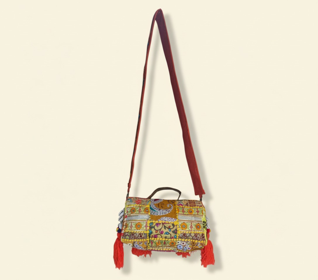 Model carrying Shell Tassel Moonga crossbody bag — boho style