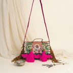 Model carrying Shell Tassel Gulaabi crossbody bag — boho style