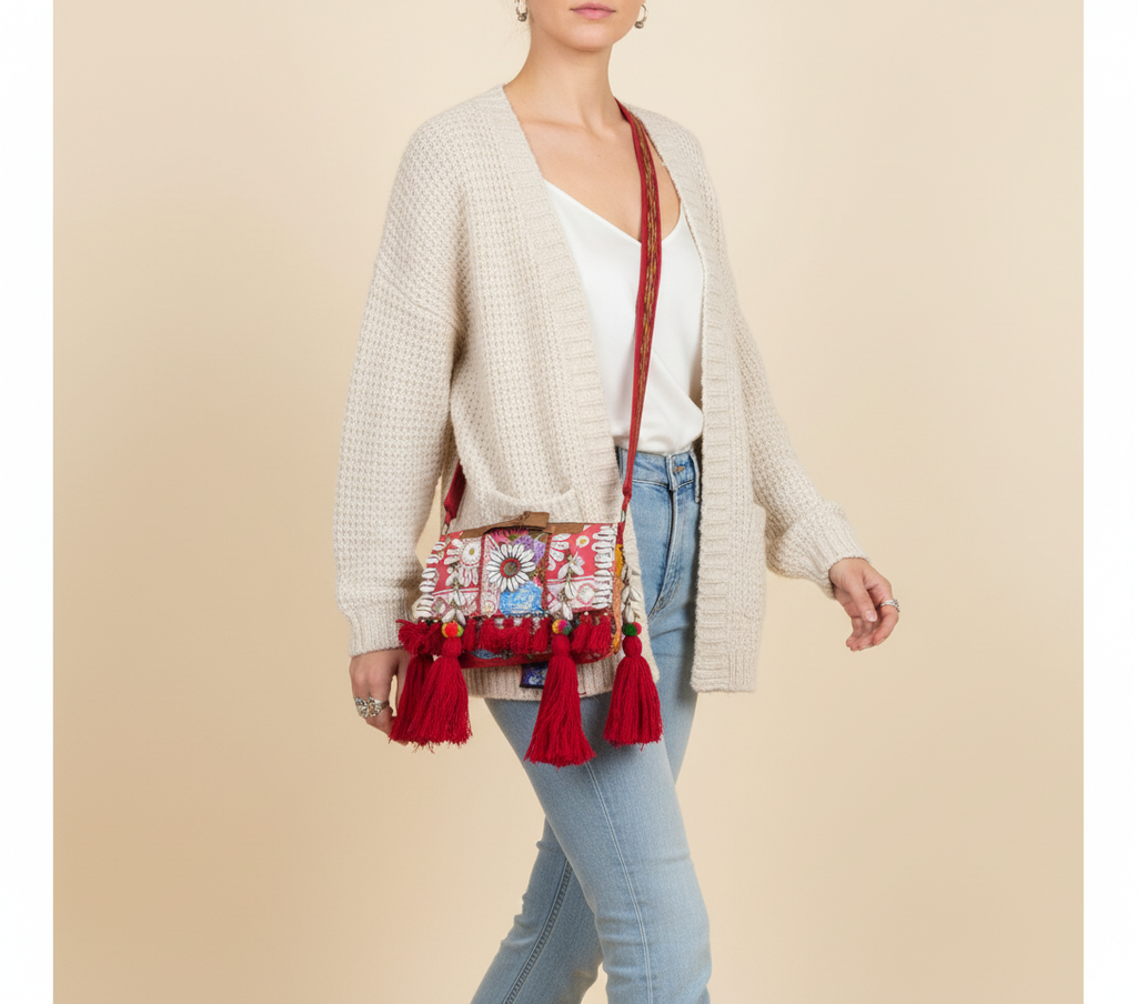 Model carrying Shell Tassel Tambra crossbody bag — boho style