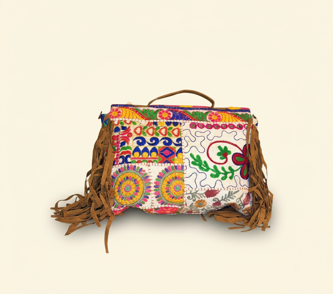 Close-up of Dugdh cowrie shell & tassel detail