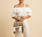 Close-up of Karpas cowrie shell & tassel detail
