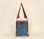 Model carrying Shell Tassel Indigo Festival sling bag — boho style