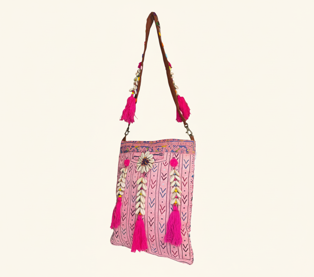 Close-up of Rose Chevron cowrie shell & tassel detail