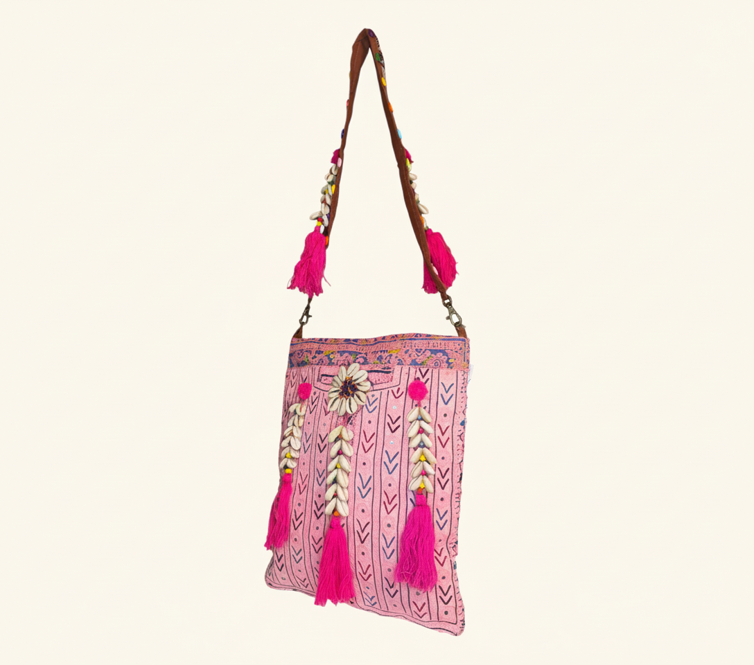 Close-up of Rose Chevron cowrie shell & tassel detail