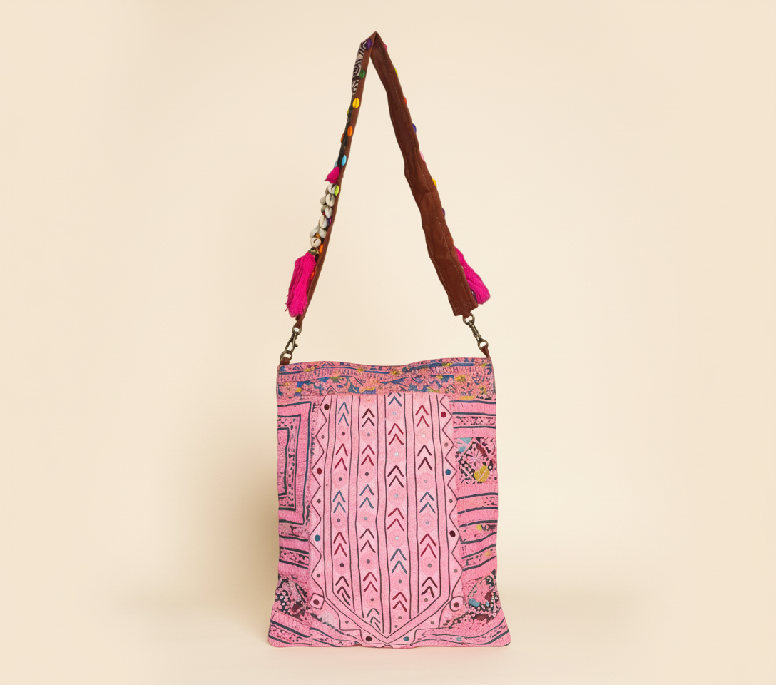 Model carrying Shell Tassel Rose Chevron sling bag — boho style