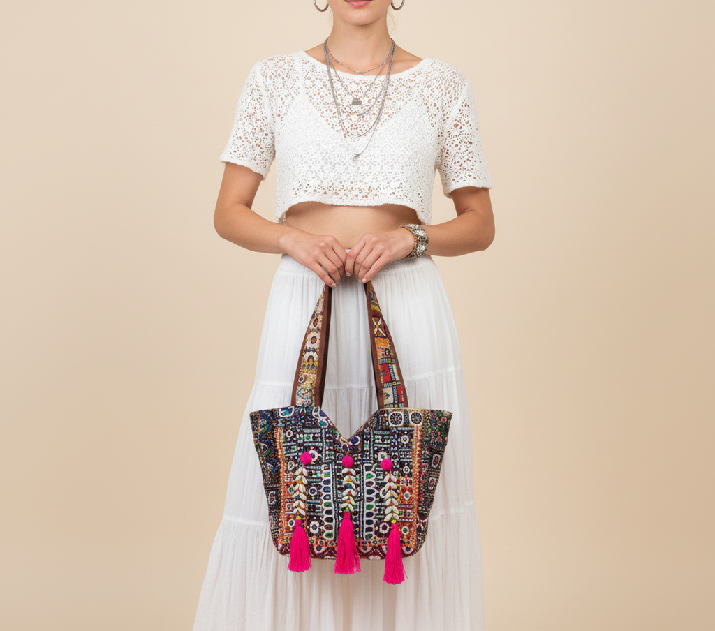 Model carrying Shell Tassel Midnight Carnival tote bag — boho style