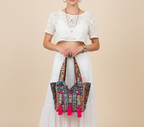 Model carrying Shell Tassel Midnight Carnival tote bag — boho style