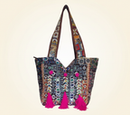 Model walking with Shell Tassel Midnight Carnival tote bag — lifestyle shot
