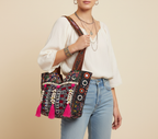 Model carrying Shell Tassel Ruby Tapestry tote bag — boho style