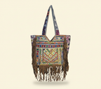 Model carrying Shell Tassel Amber Fringe tote bag — boho style