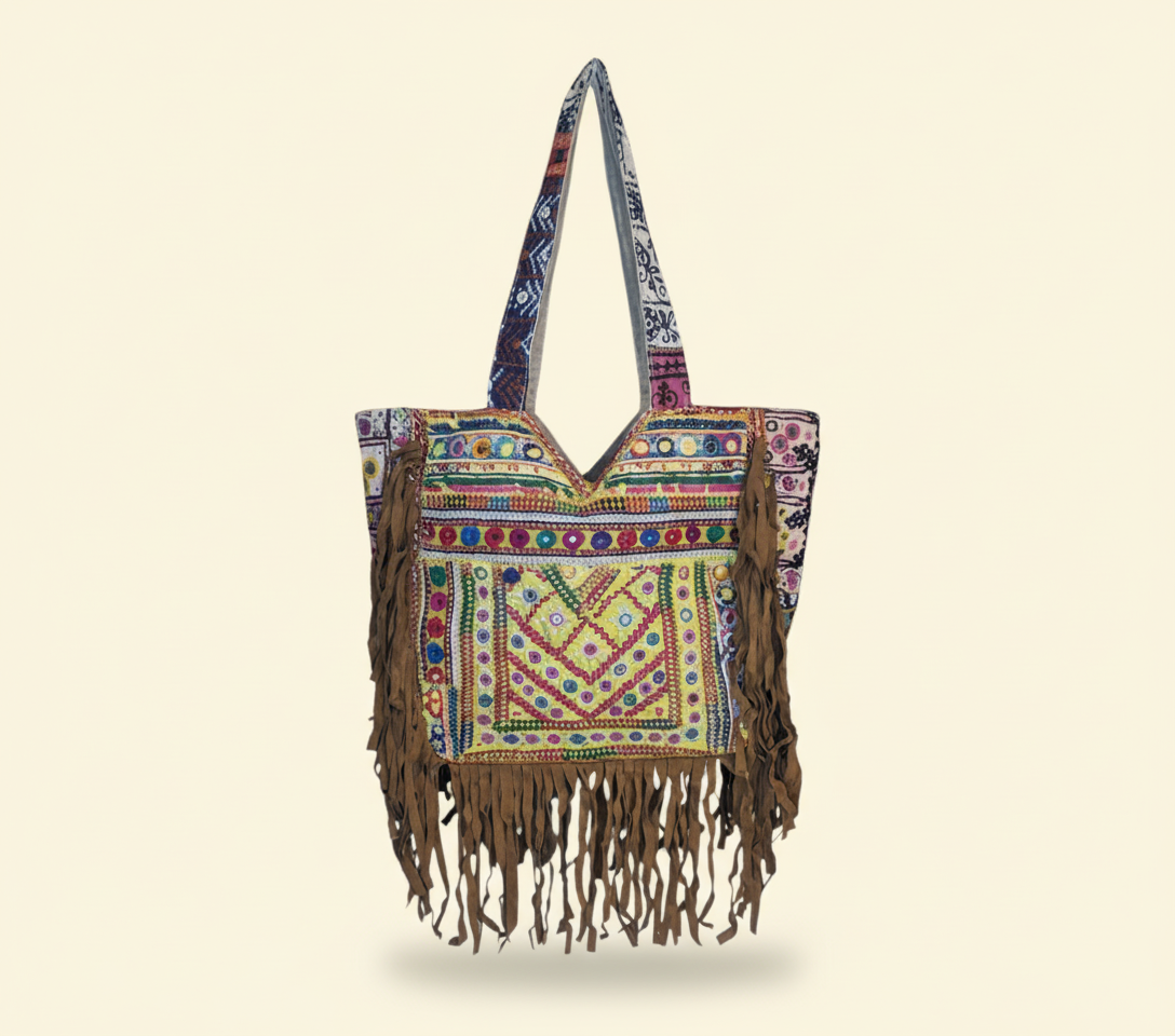 Model carrying Shell Tassel Amber Fringe tote bag — boho style