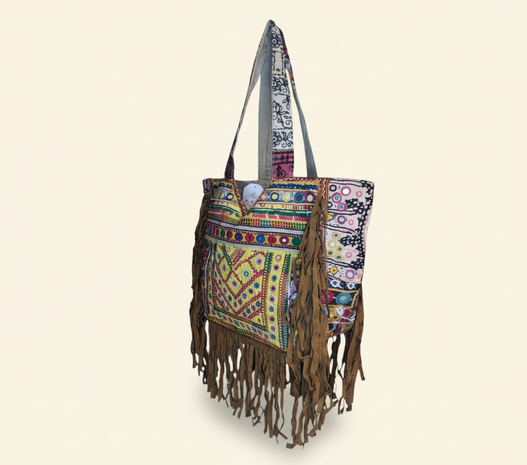 Model walking with Shell Tassel Amber Fringe tote bag — lifestyle shot