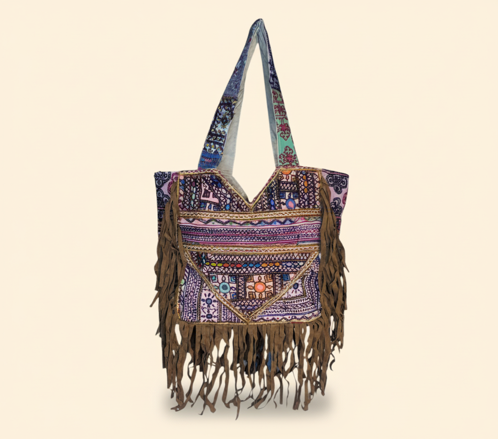 Close-up of Indigo Fringe cowrie shell & tassel detail