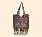 Close-up of Indigo Fringe cowrie shell & tassel detail