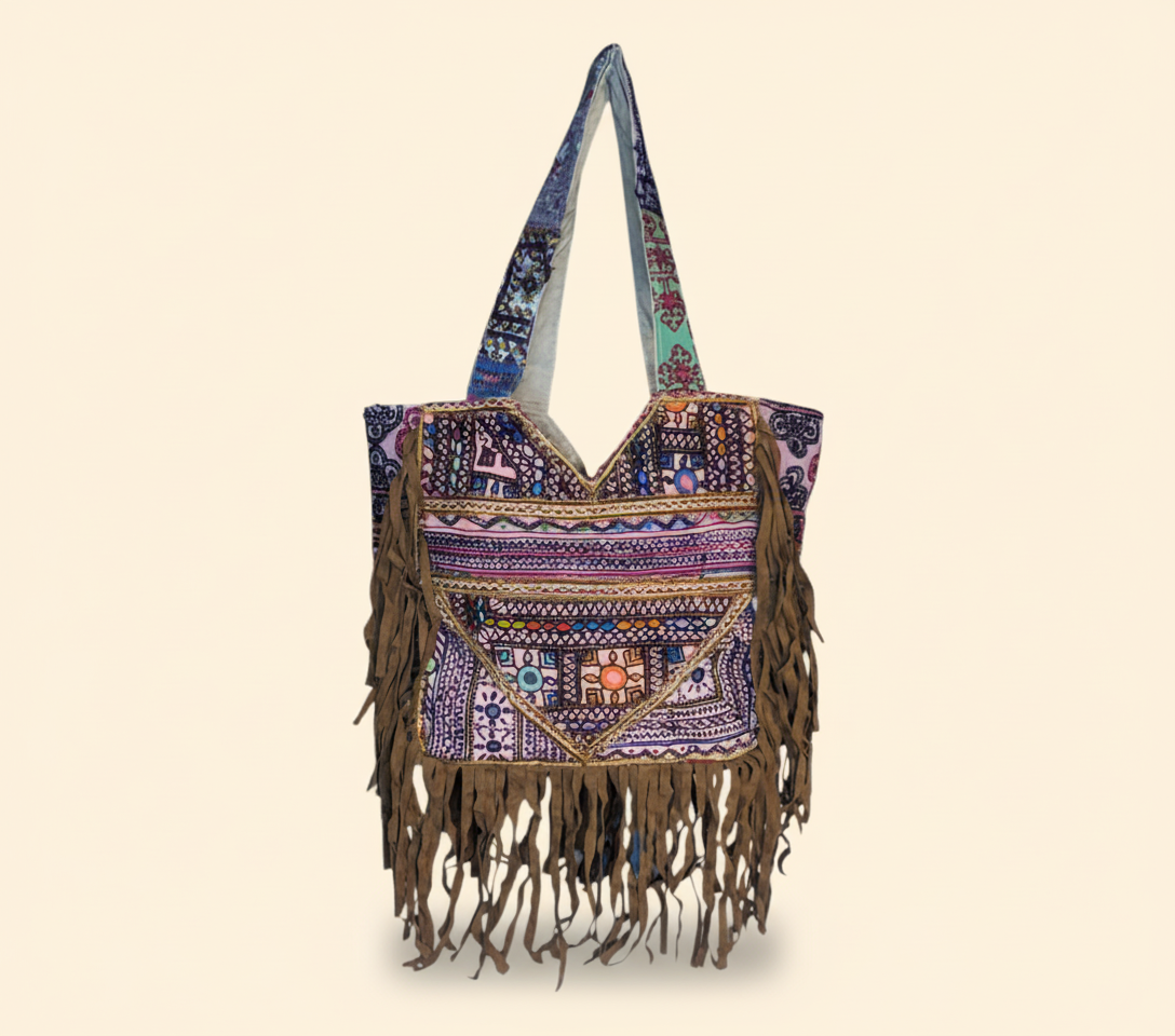 Close-up of Indigo Fringe cowrie shell & tassel detail
