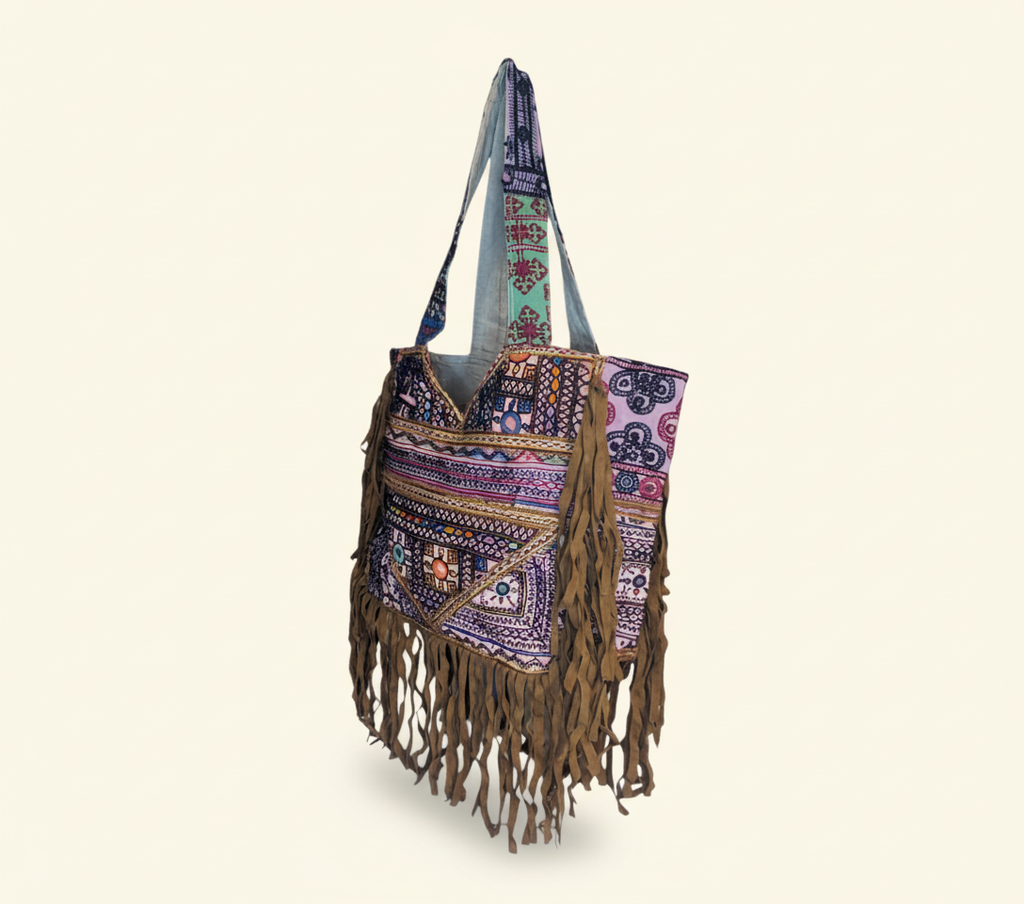Model carrying Shell Tassel Indigo Fringe tote bag — boho style