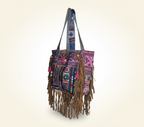 Close-up of Orchid Fringe cowrie shell & tassel detail