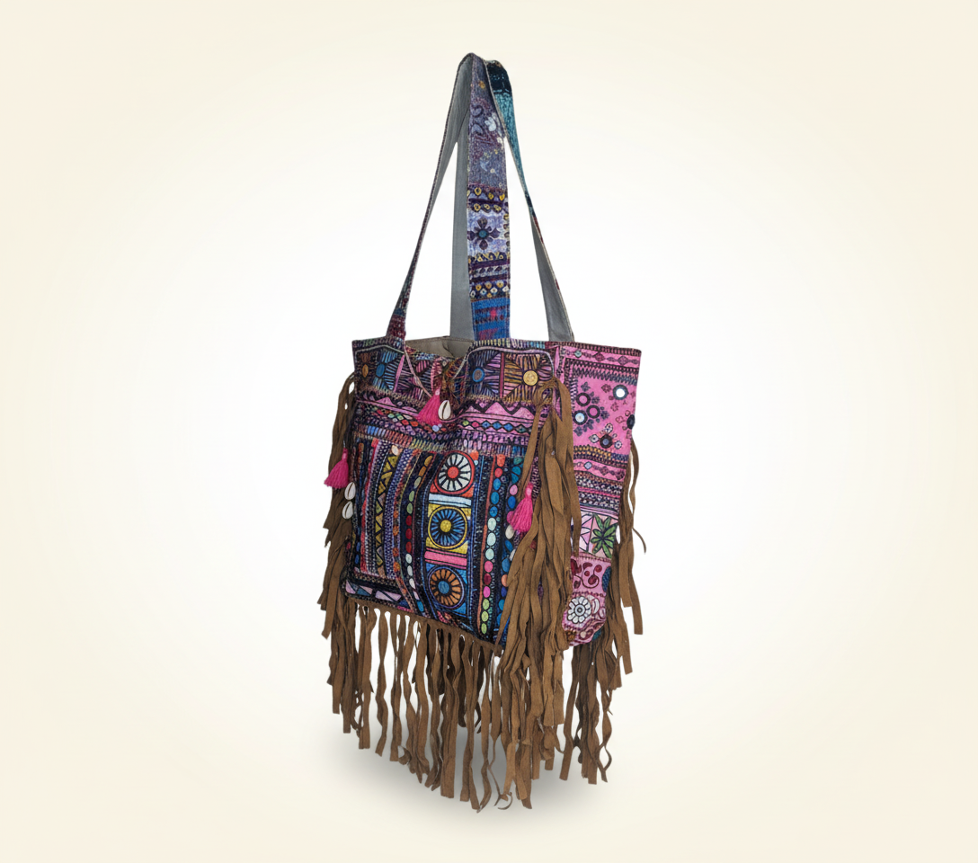 Close-up of Orchid Fringe cowrie shell & tassel detail