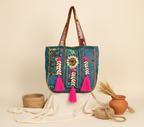 Model carrying Shell Tassel Teal Festival tote bag — boho style