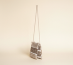Woven Earth Dune Lattice sling bag side view showing strap