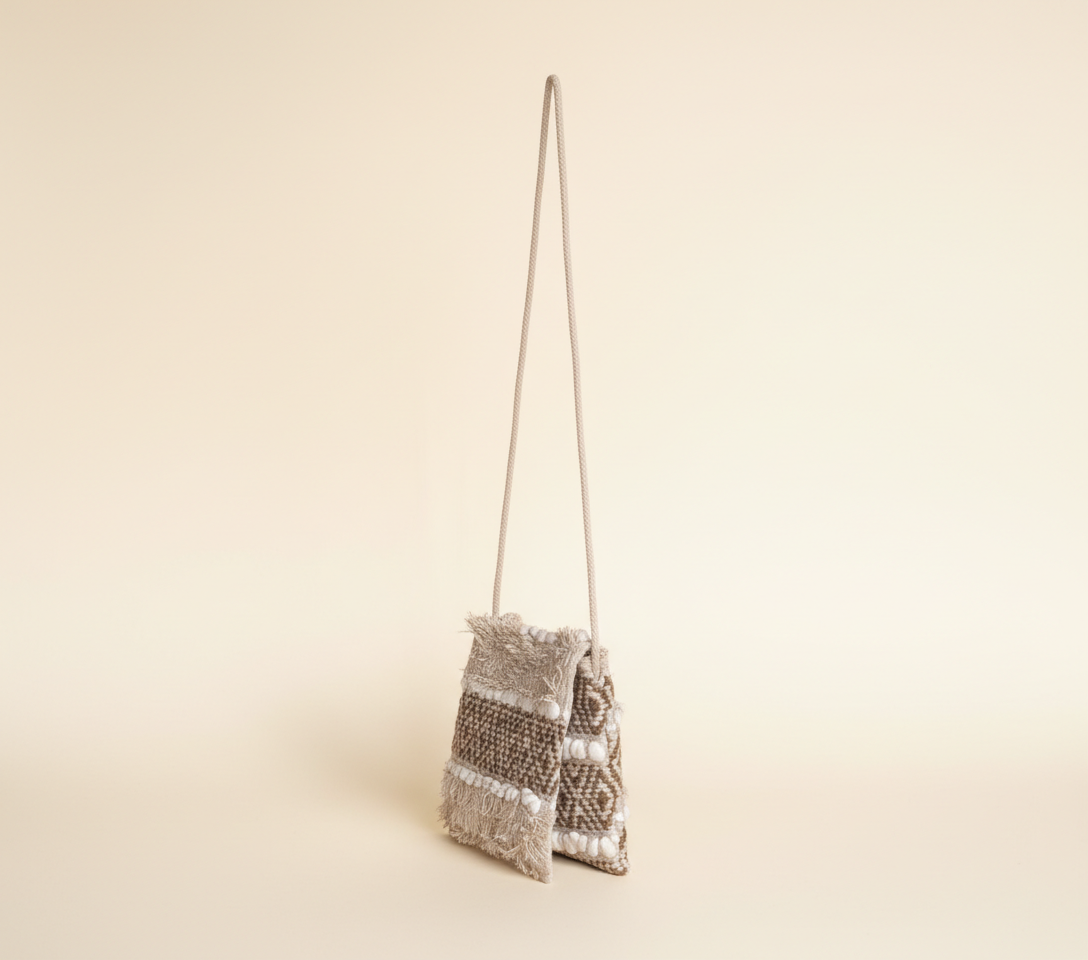 Woven Earth Dune Lattice sling bag side view showing strap