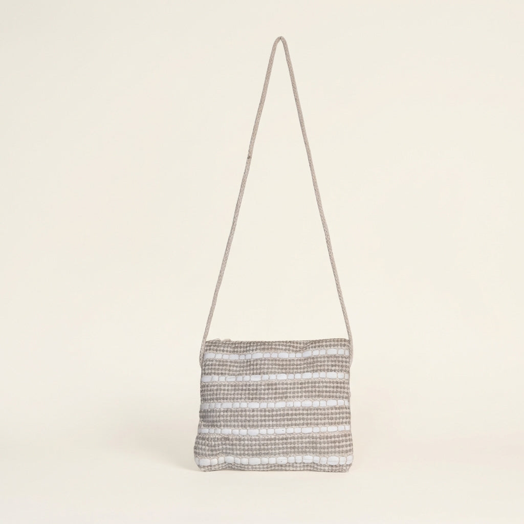 Close-up of Sand Chevron artisan weave texture on sling bag