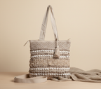 Model carrying Woven Earth Dune Crosshatch tote bag — boho style