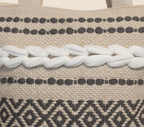 Model carrying Woven Earth Midnight Lattice tote bag — boho style