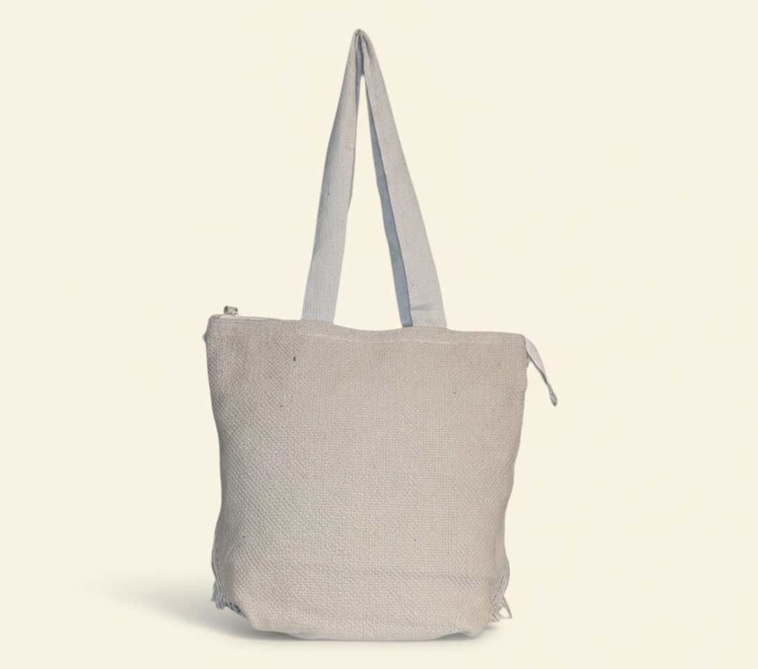 Model carrying Woven Earth Onyx Chevron tote bag — boho style