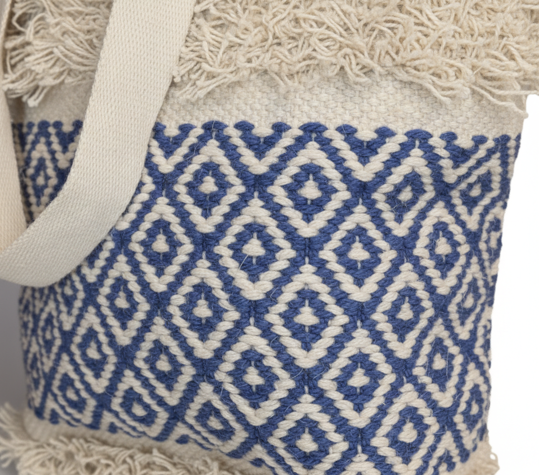 Model carrying Woven Earth Ocean Lattice tote bag — boho style