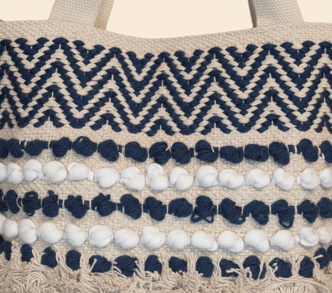 Model carrying Woven Earth Azure Chevron tote bag — boho style